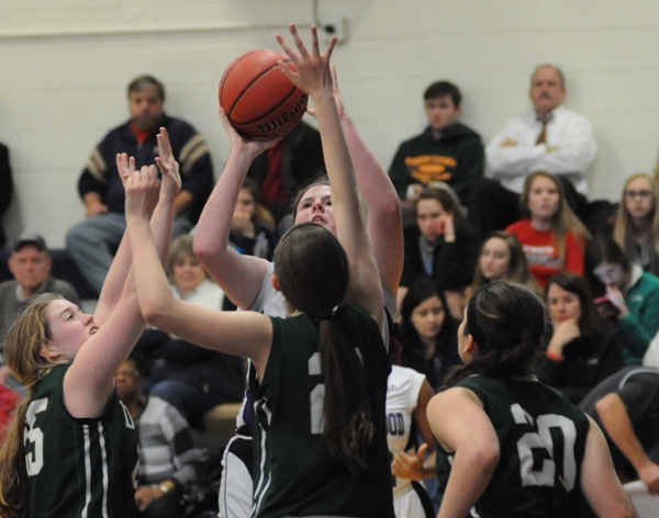 Caroline Snare shoots over Kennedy players.