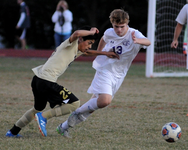 Sean Reilly (right) races against a Windsor player.