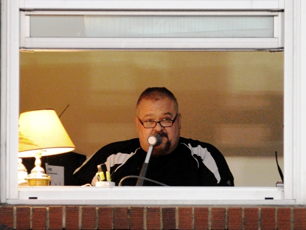 Dan Williams, the voice of Brentwood football, announces the game over the P.A. system.