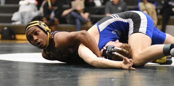 Gary Silerio closes in on pinning Dillon Liefer of Lutheran St. Charles at the district meet on Feb. 3. Silerio took second place to qualify for the state meet last week.