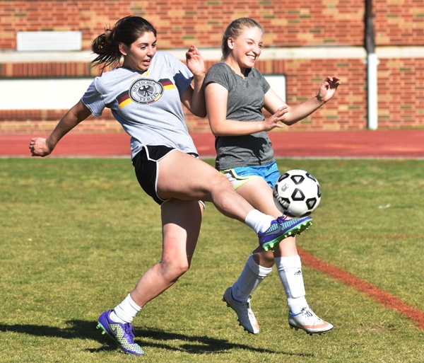 Senior midfielder Megan Shipley (left) and freshman Rebecca Walthall.